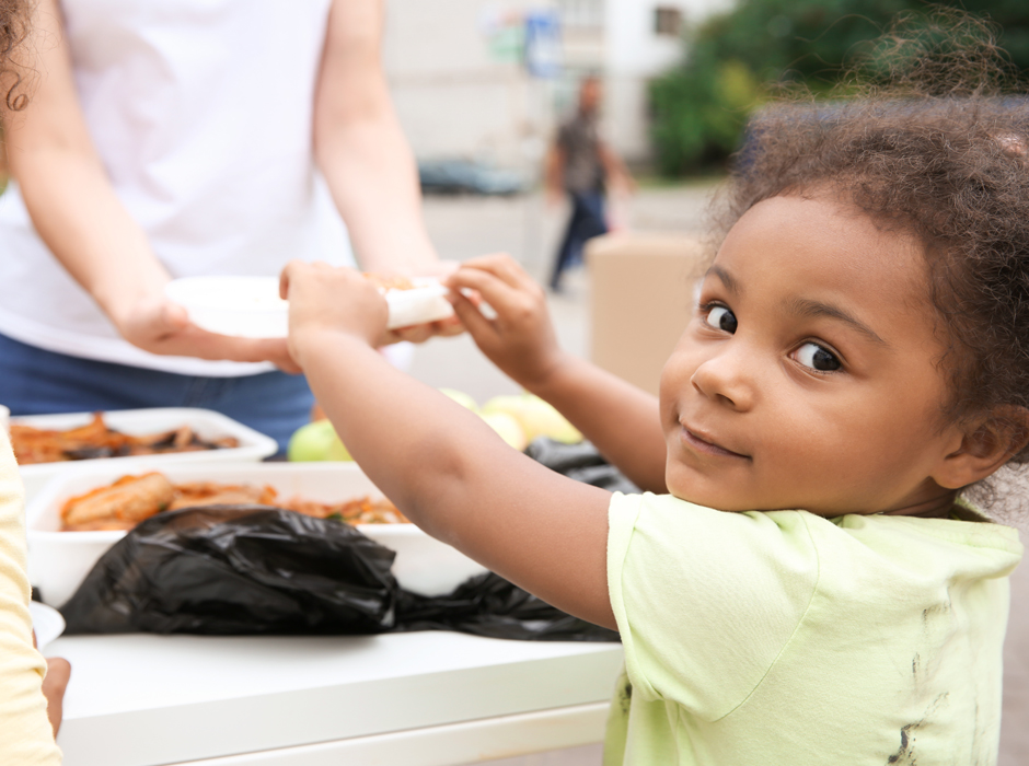 girl reaching for food