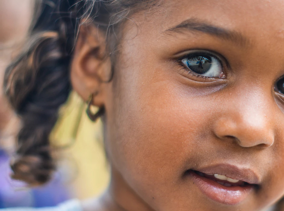 cute african american girl looking at camera and smiling